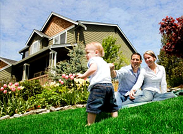 A family in front of their home